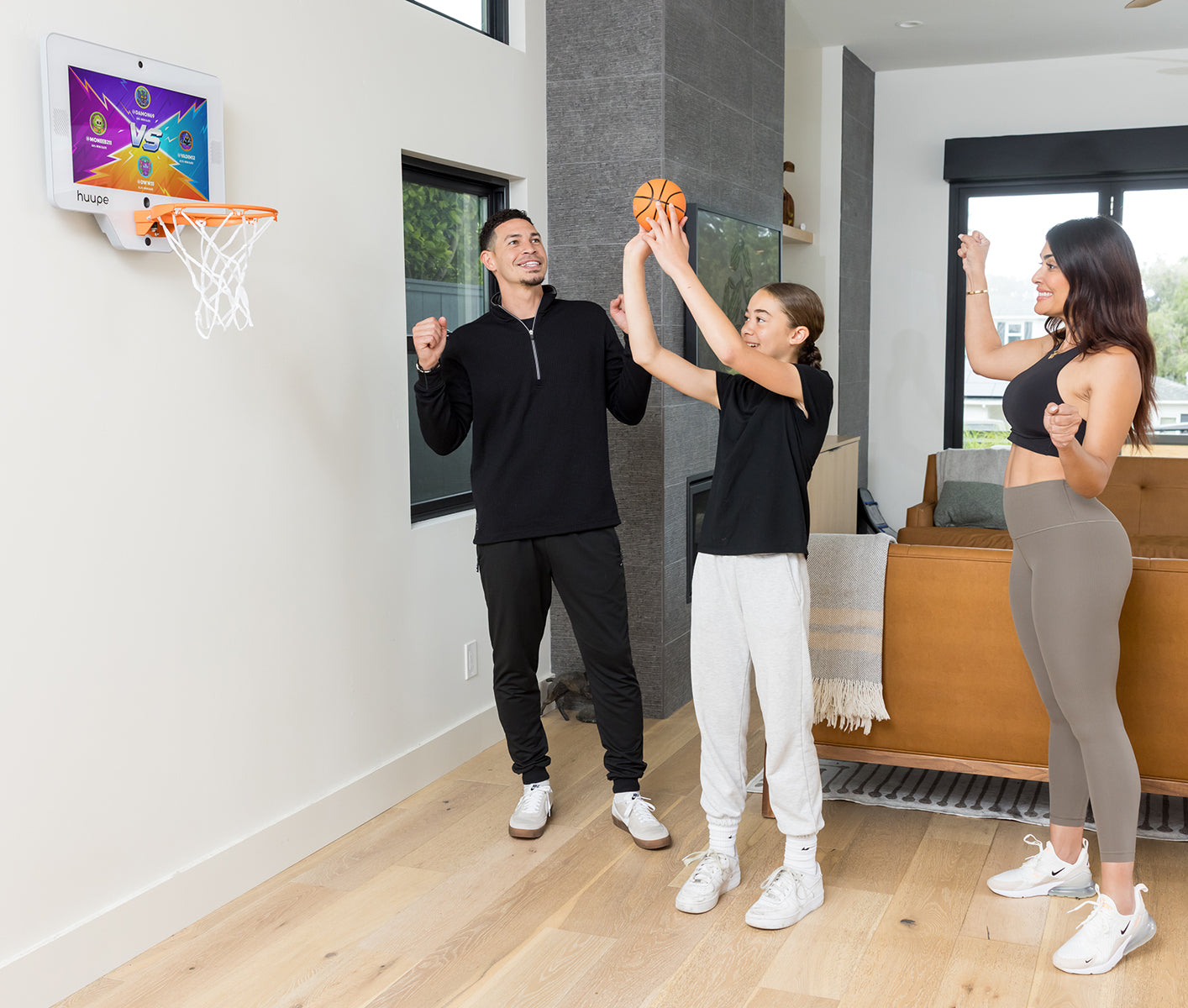 Family playing huupe mini together